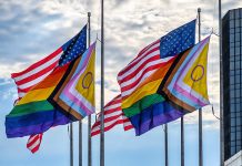 14 Pride Celebrations Taking Place in Metro Detroit American flags and LGBTQ rainbow flags flying together in the wi