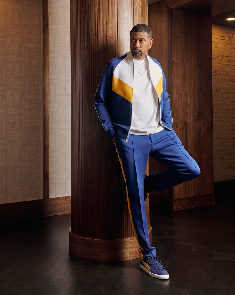 For his second look, Jalen Rose wears a Richfresh tracksuit with Puma shoes. The colors are reminiscent of his alma mater, the University of Michigan, where he and others in the “Fab Five” led the Wolverines to the 1992 and 1993 NCAA men’s Division I basketball championship games.