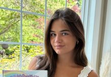 Lila Shea posing with her book
