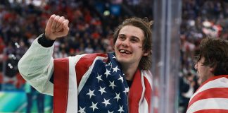 Jack Hughes #86 of Team United States celebrates after their gold-medal win during the Men's Gold Medal match between Canada and the United States on day 16 of the Milano Cortina 2026 Winter Olympic games at Milano Santagiulia Ice Hockey Arena on February 22, 2026 in Milan, Italy.