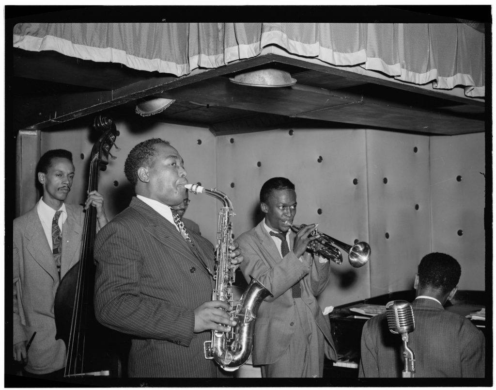 Miles Davis performs with Charlie Parker at the Three Deuces in New York City, 1947. 