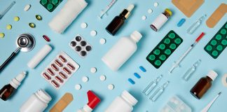 full frame shot of composed various medical supplies on blue surface