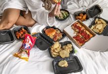 Best of Detroit 2026: Food & Drinks A spread of food on a hotel room bed