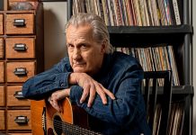 At Home with Jeff Daniels Jeff Daniels posing with a guitar.