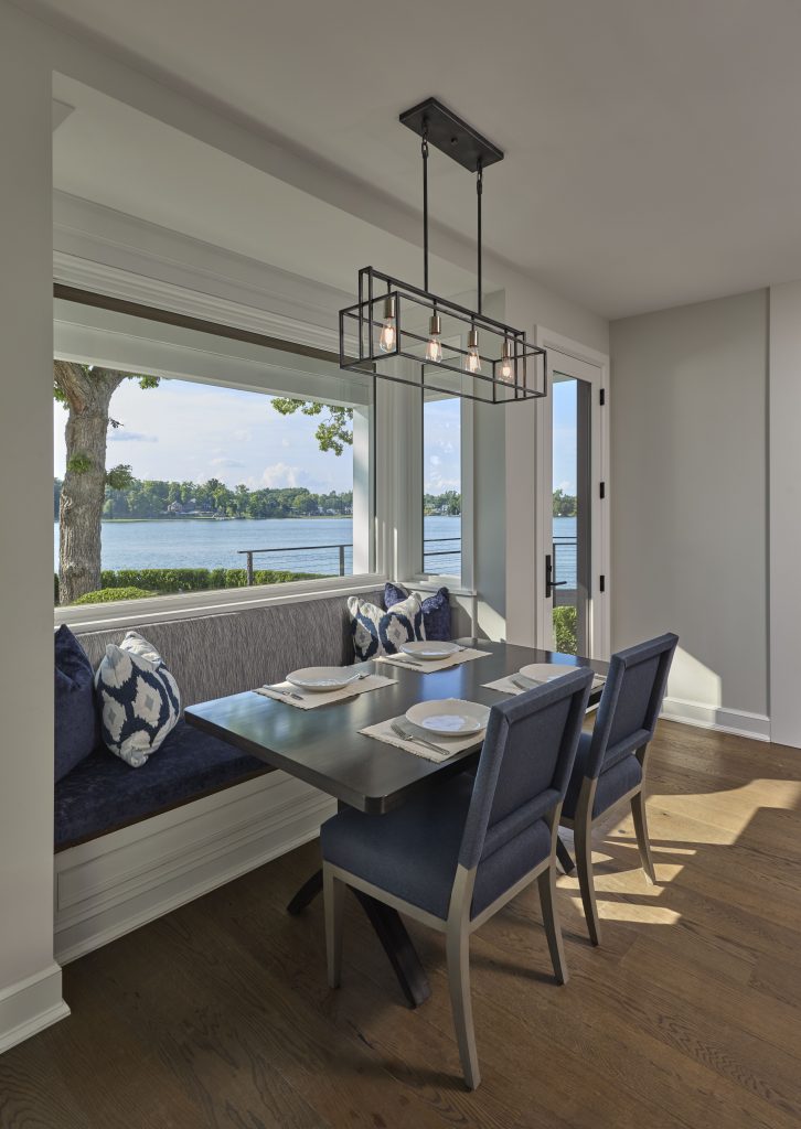 Everyone loves sitting at the cozy breakfast nook, adorned with shades of blue that complement the great outdoors.