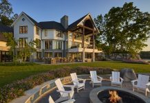 Inside a Stunning Blain Island Home in Waterford Township A fire pit sits close to the beach.