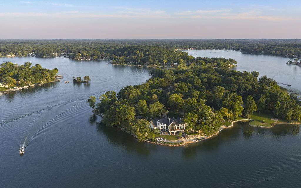 This aerial view captures Blain Island and the breathtaking home surrounded by Maceday Lake. 