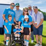 Miracle Network Family-Ryan, Liz, Alex, Max and Maddie Majewski, Jim, Bob, and Paul Wahlberg with Alama Wahlberg Award.