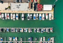 Aerial top down view of Motor city Marina, many boats docked at the shore in Wyandotte, Michigan
