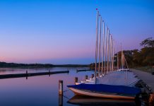 Scenic landscape of many sail boats at Kensington metro park in Michigan.