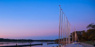 Scenic landscape of many sail boats at Kensington metro park in Michigan.