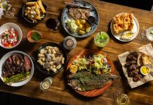 Hour Detroit’s Best New Restaurants 2026: Bar Gabi in Hazel Park Dishes, clockwise from top center: ceafa de pork, Gabriela’s focaccia, mititei, saramura de peste (sea bass), rigatoni, “Vaca Moo” steak,salata de vara, hand-cut fries.