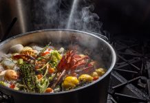 Hour Detroit’s Best New Restaurants 2026: Ostrea in Detroit Lobster poached with flavorful aromatics like thyme, onion, celery, bay leaves, lemon, and cherry tomatoes.