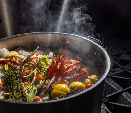 Hour Detroit’s Best New Restaurants 2026: Ostrea in Detroit Lobster poached with flavorful aromatics like thyme, onion, celery, bay leaves, lemon, and cherry tomatoes.