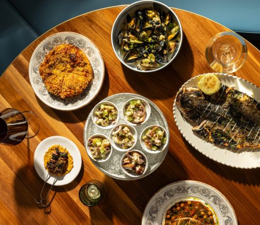 Bottom, clockwisefrom top right: sfincione, mussels bianco, branzino, pesce spada, insalata di mare, spiedini (lamb belly skewers).