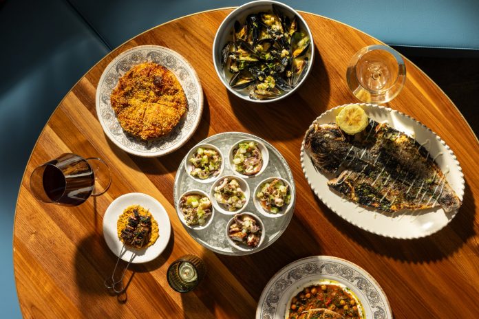 Bottom, clockwisefrom top right: sfincione, mussels bianco, branzino, pesce spada, insalata di mare, spiedini (lamb belly skewers).