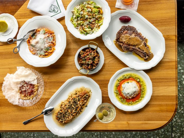 HOUR BEST NEW1782 From top, clockwise house wedge salad, dry aged bone-in ribeye with zip sauce, fried burrata, dirty martini, dover sole au meunière, roasted mushrooms.
