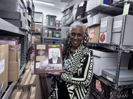 A Brief History on the Detroit Sound Conservancy DSC director and director of collections Michelle Jahra McKinney holds up a scrapbook from the DSC archives, currently housed in Detroit’s WGPR 107.5 FM building.