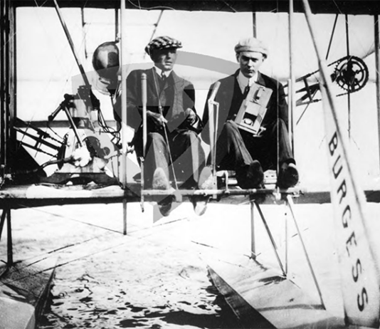 On June 18, 1912, Kuenzel was pictured sitting next to pilot Walter Brookins in a Burgess-Wright hydroairplane, cradling his camera as he prepared to capture the first aerial photos ever taken by a Detroit photojournalist.