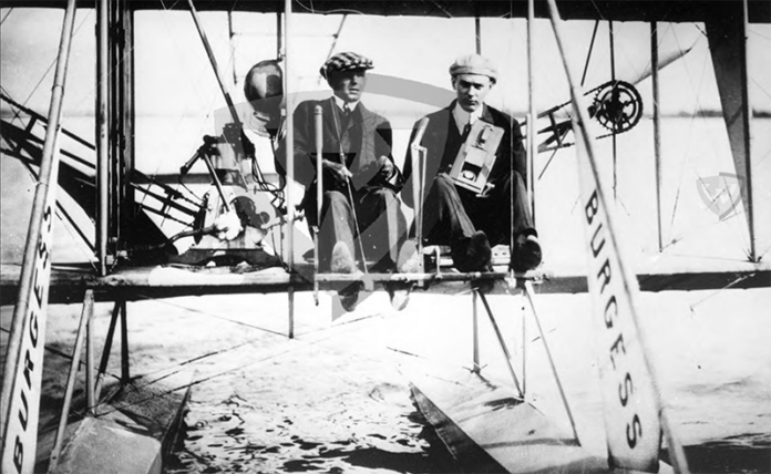 On June 18, 1912, Kuenzel was pictured sitting next to pilot Walter Brookins in a Burgess-Wright hydroairplane, cradling his camera as he prepared to capture the first aerial photos ever taken by a Detroit photojournalist.