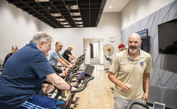 Kirk Gibson himself takes classes at the center, his favorite being tai chi. He's shown here with members completing a spinning workout.