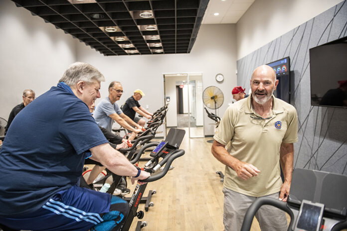 _DSC5655-4 Kirk Gibson himself takes classes at the center, his favorite being tai chi. He's shown here with members completing a spinning workout.