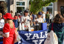 Brighton Brings Stars Hollow to Life for Its Third Annual ‘Gilmore Girls’ Festival A small stand decorated in a Yale flag selling coffee at Destination Starz Hollow in Brighton, Mich.