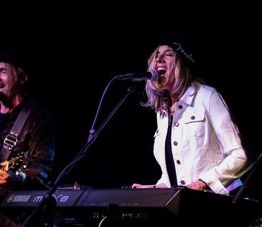 Carolyn Striho performing on stage.