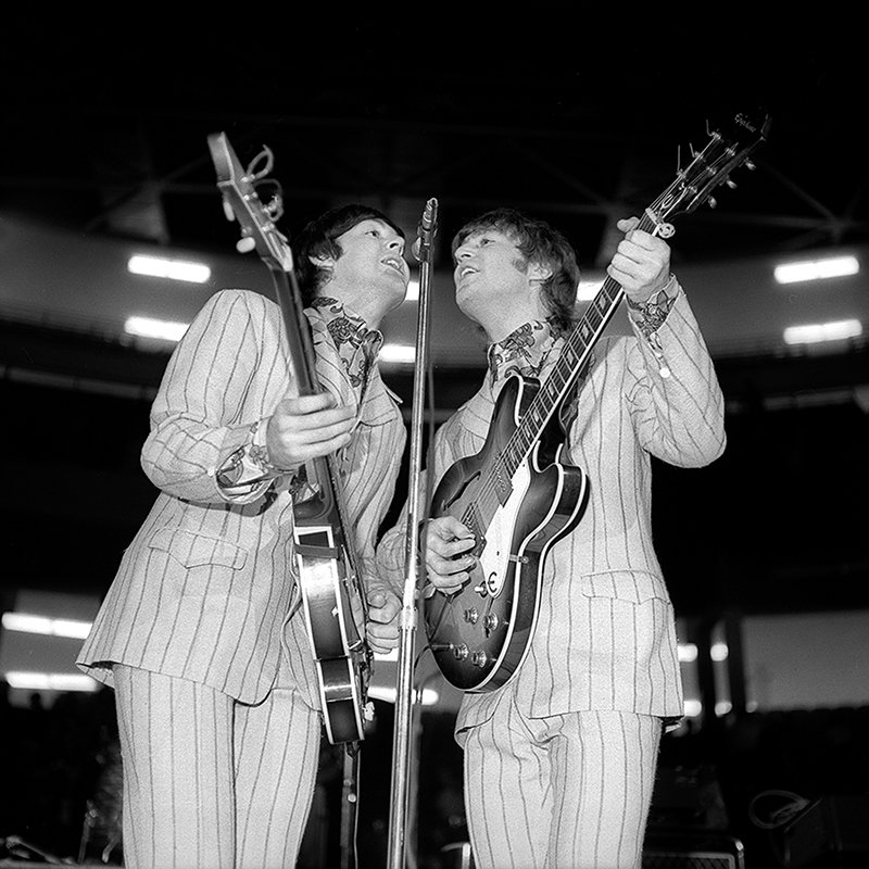 Paul McCartney and John Lennon performing at the Olympia in Detroit in 1966.