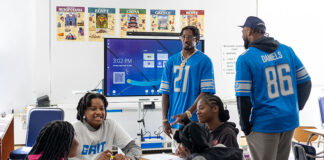 Former Lions players Tracy Walker and Darrell Daniels visit with Detroit Lions Academy students.