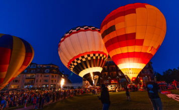 Bay Harbor: Balloons, Broadway Musicals, and Beautiful Views Hot air balloons inflated at night.