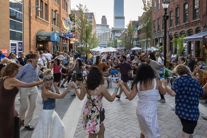 GNP Streetscape image 2 People dancing in the Greektown Monroe Streetscape