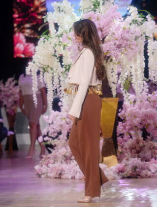 Destiny & Co.: structured cropped jacket trimmed in gold tassels.