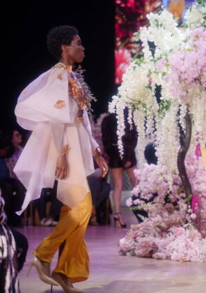 Key Da Brand: flowy, high-low crop top with voluminous sleeves.